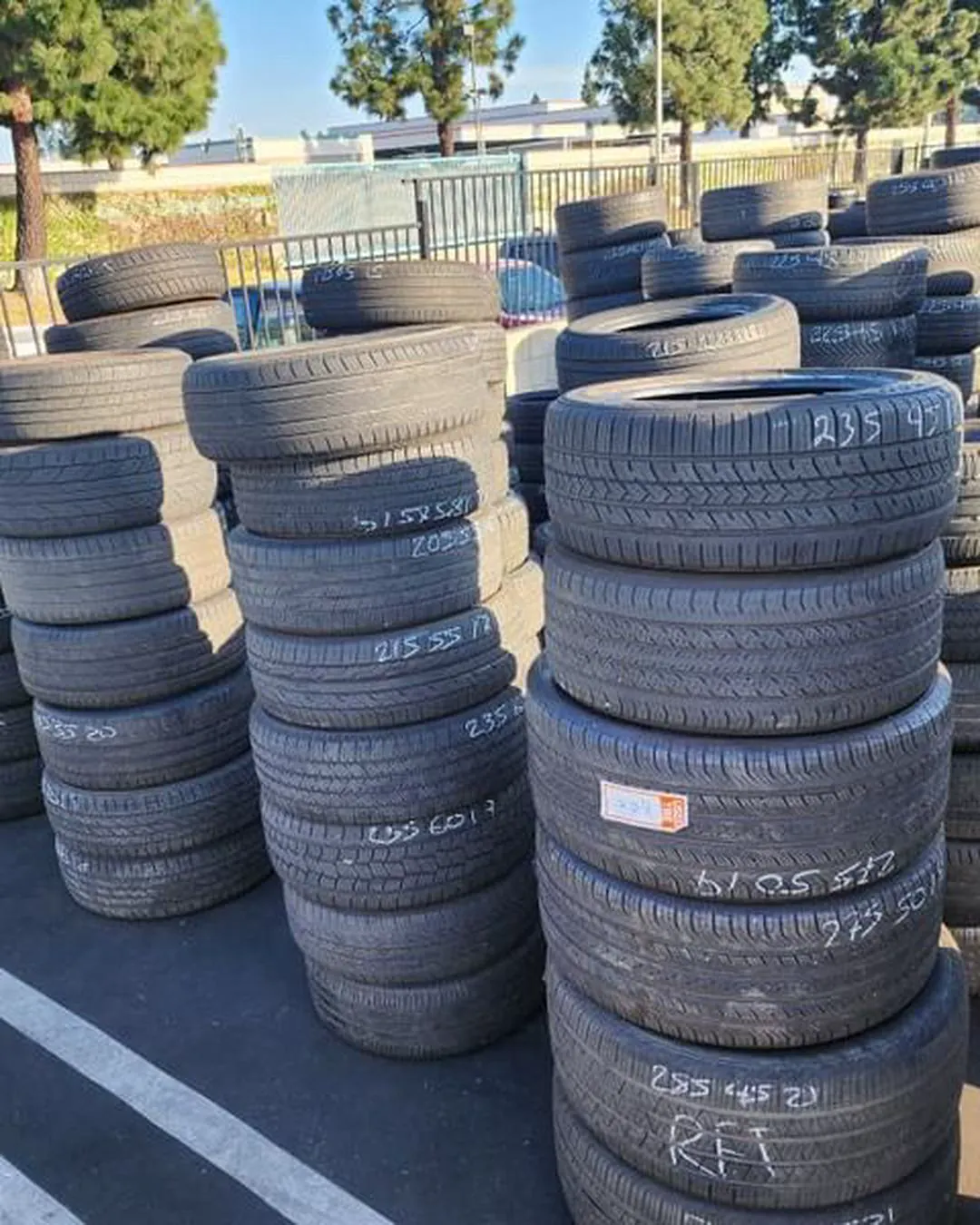 Wide view of grouped tire stacks in the yard